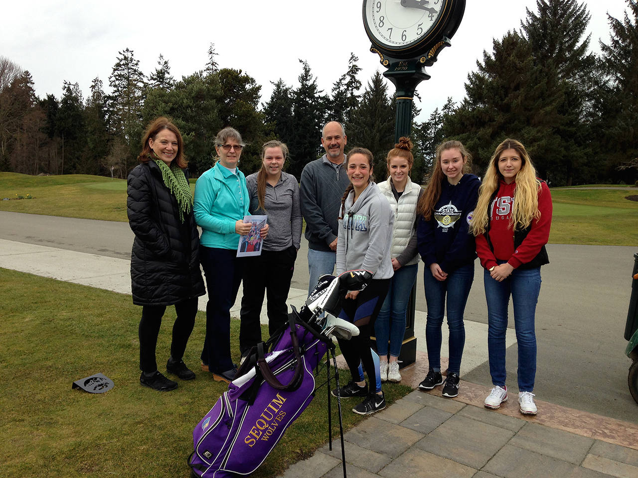 The Cedars at Dungeness Women’s Golf Club donated proceeds from its annual Whine & Roses Golf Tournament to the Sequim High School Golf program. Women’s Club Co-Captain Judy Reno, far left, is joined by Captain Lisa Ballanytne in presenting the donation to Sequim girls golfer Sarah Shea, head coach Gary Kettel and team members Christiana Hoesel, Samantha Smith, Brittney Gale and Angela Carillo-Burge.