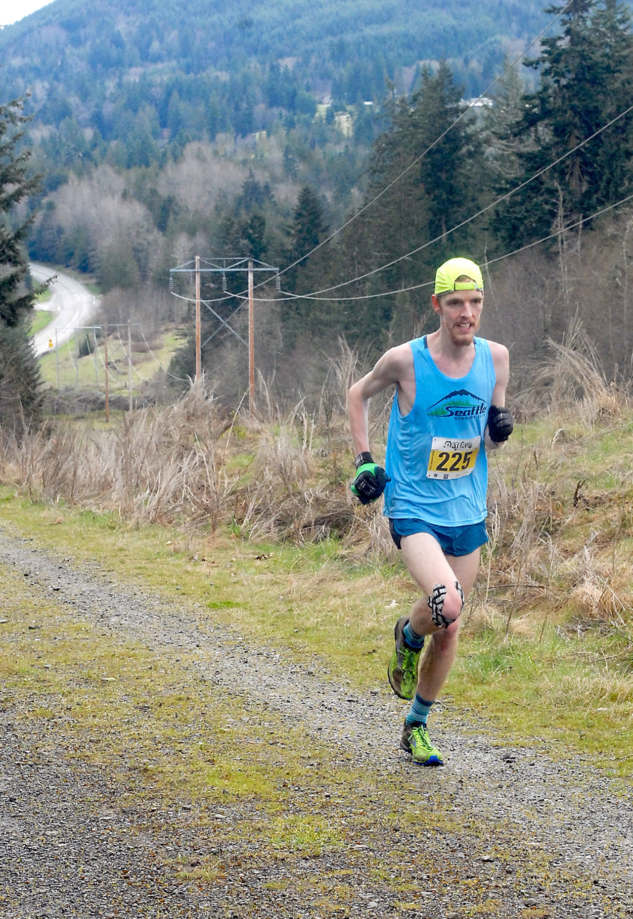 Keith Thorpe/Peninsula Daily News Keith Laverty of Bainbridge Island ascends the last hill towards the finish to win the half marathon of the Olympic Adventure Trail Run on Saturday west of Port Angeles. A total of 282 runners were registered to take part in full and half marathons on a tortuous route along the adventure trail.                                Keith Thorpe/Peninsula Daily News Keith Laverty of Bainbridge Island ascends the last hill towards the finish to win the half marathon of the Olympic Adventure Trail Run on Saturday west of Port Angeles. A total of 282 runners were registered to take part in full and half marathons on a tortuous route along the adventure trail.