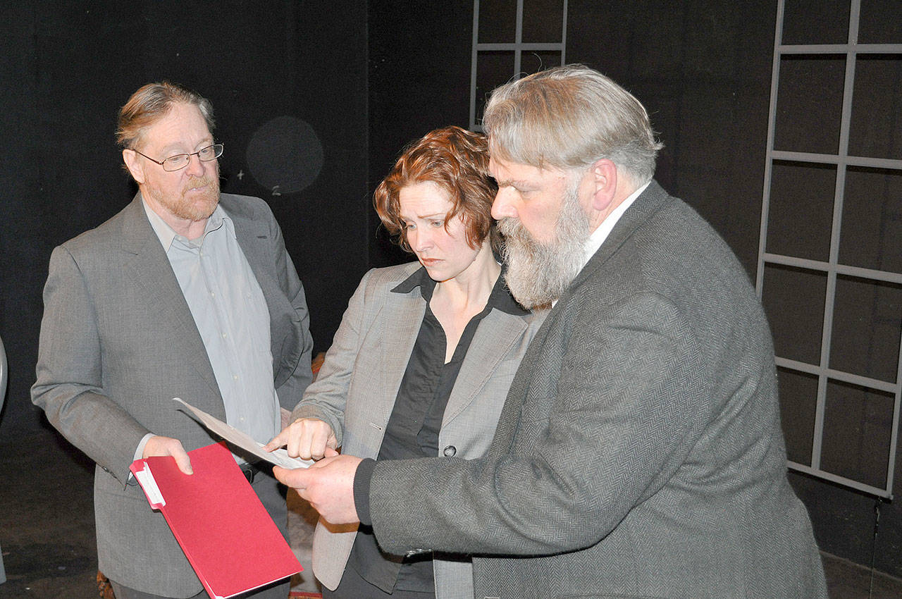 Dr. Stockmann, played by John Clark, presents his findings to Hovstad (Crystal Eisele) and Billing (Mark Valentine), newspaper editors who let their journalistic interest run unchecked in Key City Public Theatre’s production of the Henrik Ibsen play “An Enemy of the People.” The play opened Thursday night and will remain on stage through April 22. (Key City Public Theatre).