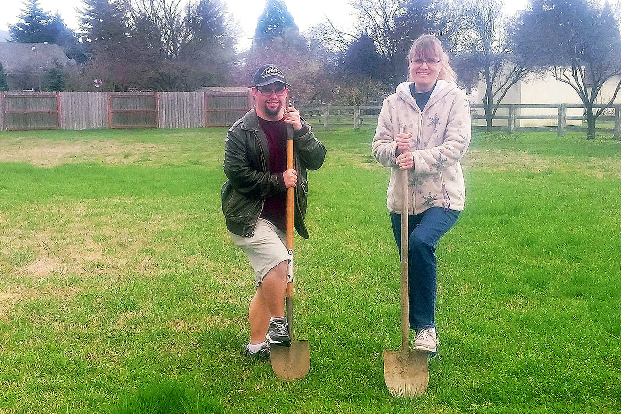 Michael Rief and Ursula Schletter break ground on the first house in Sequim for Olympic Peninsula Special Needs Housing. (Tom Rief)