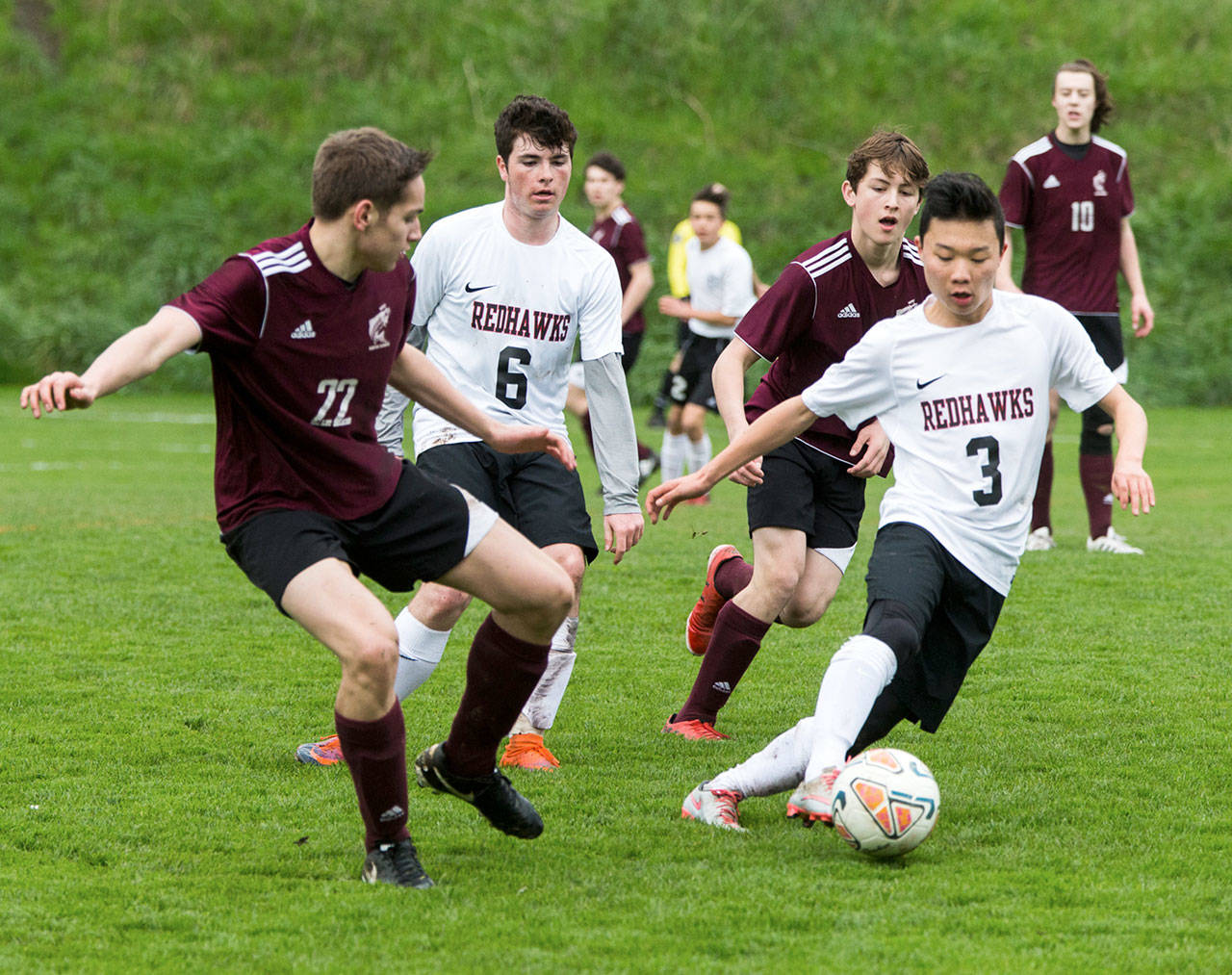 Steve Mullensky/for Peninsula Daily News                                Port Townsend’s Aaron Lee, boots the ball away from Ketchikan’s Brent Taylor during a friendly game at Memorial Field in Port Townsend.