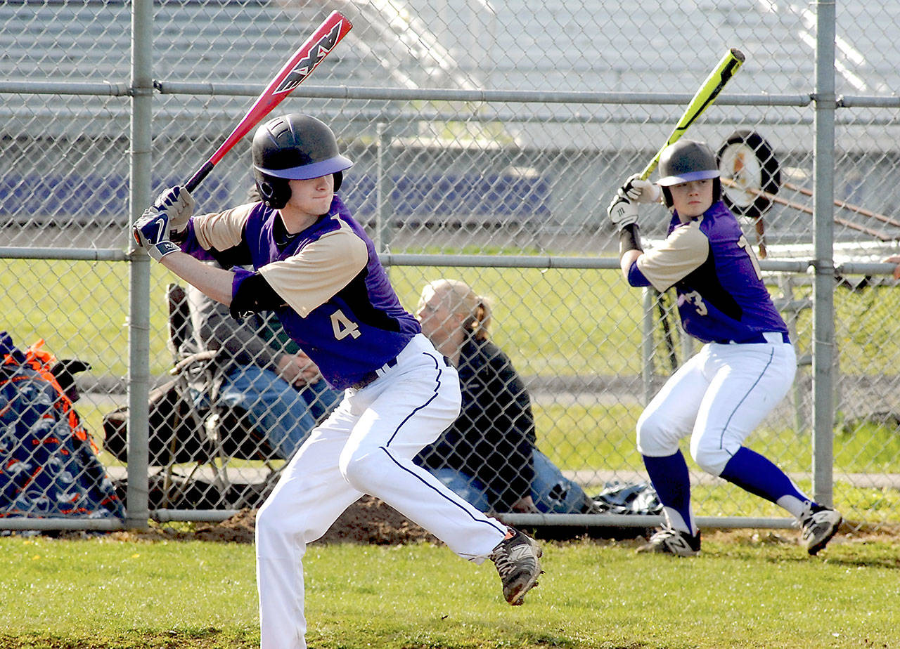 Keith Thorpe/Peninsula Daily News Sequim&rsquo;s Ian Miller bats in the fifth inning against Bremerton as teammate Ryan Clark practices his swing in the on-deck circle on Wednesday in Sequim.
