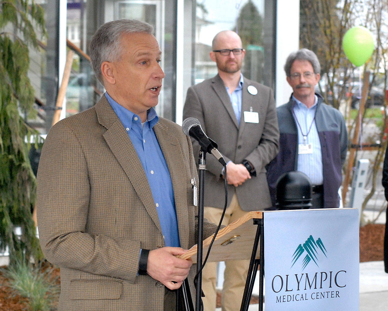 Olympic Medical Center CEO Eric Lewis, left, speaks during Saturday’s grand opening ceremony for a new medical office building constructed by OMC in Port Angeles. In the background are OMC chief physician officer Joshua Jones and and medical physician Bill Kintner. (Keith Thorpe/Peninsula Daily News)