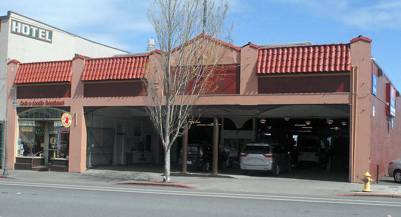 The building currently housing the garage for Budget Car Rental and Olympic Bus Lines at 111 E. Front St. in downtown Port Angeles is under consideration for purchase by the Lower Elwha Klallam Tribe for redevelopment as a hotel and restaurant. (Keith Thorpe/Peninsula Daily News)