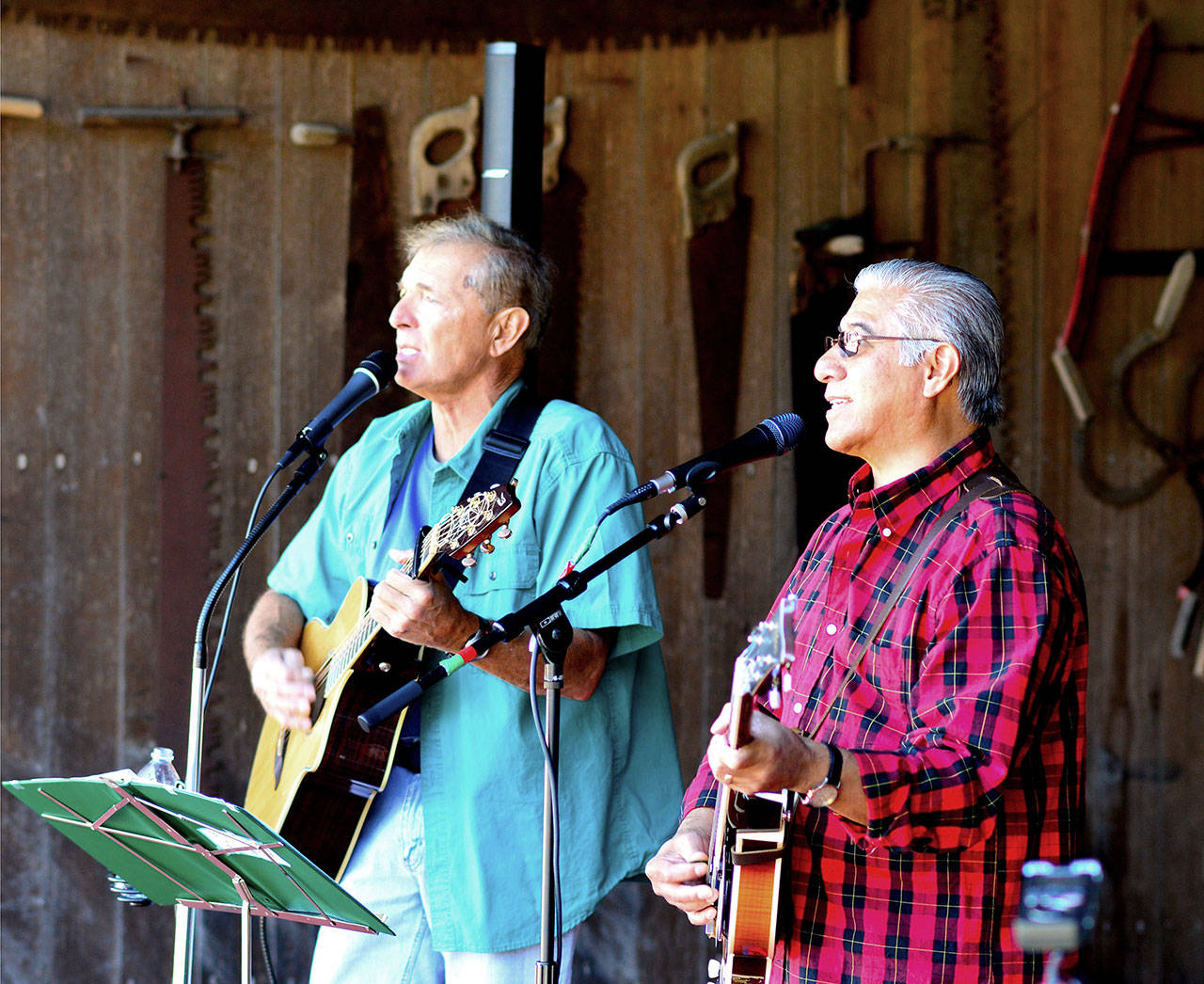 Bill Tiderman, left, and Rudy Maxion will start Sequim’s Men with Guitars concert with a singalong Saturday.