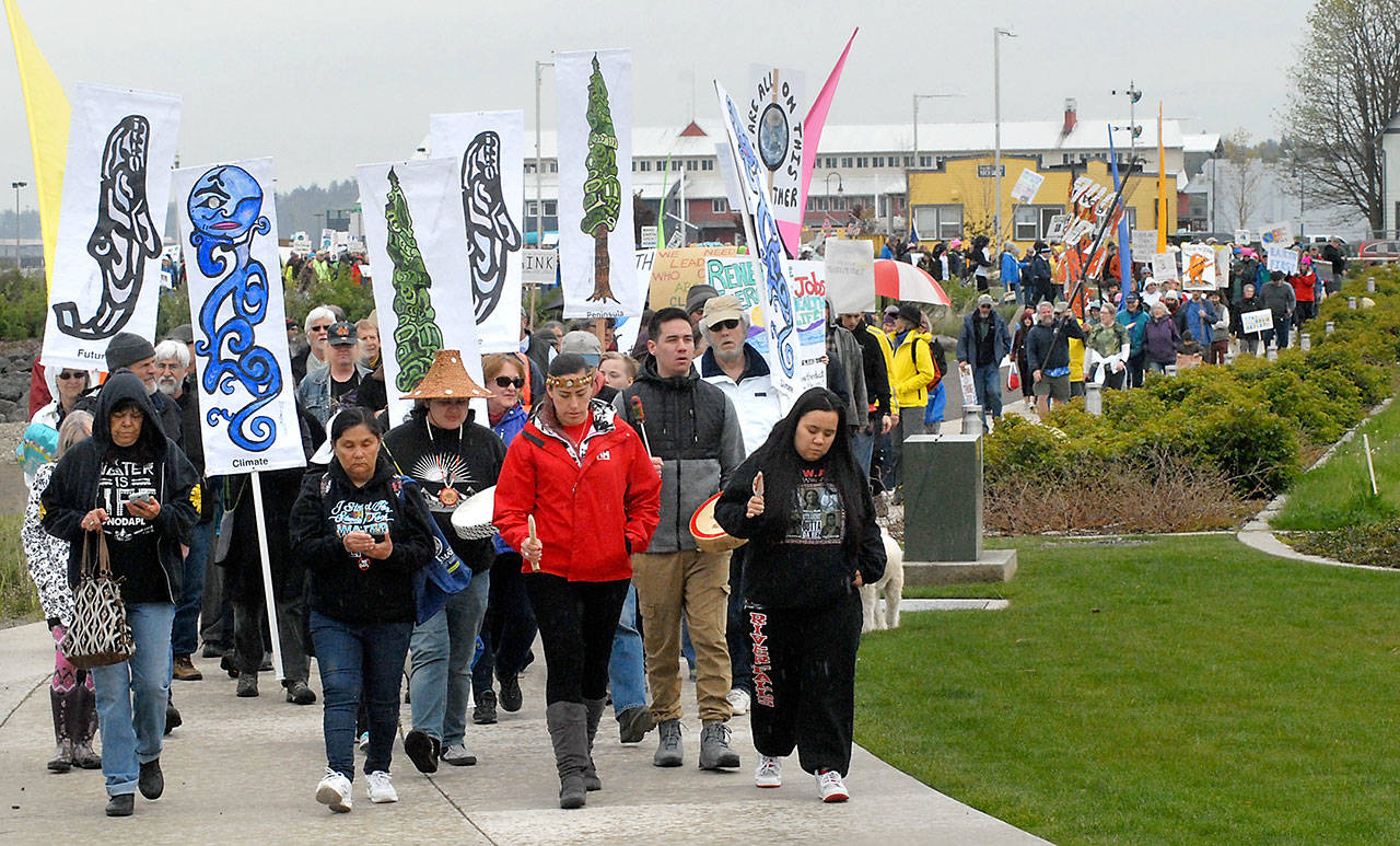 A line of more than 400 marchers make their way through West End Park on the Port Angeles waterfront Saturday to raise awareness of climate change and to promote good stewardship of the environment. (Keith Thorpe/Peninsula Daily News)