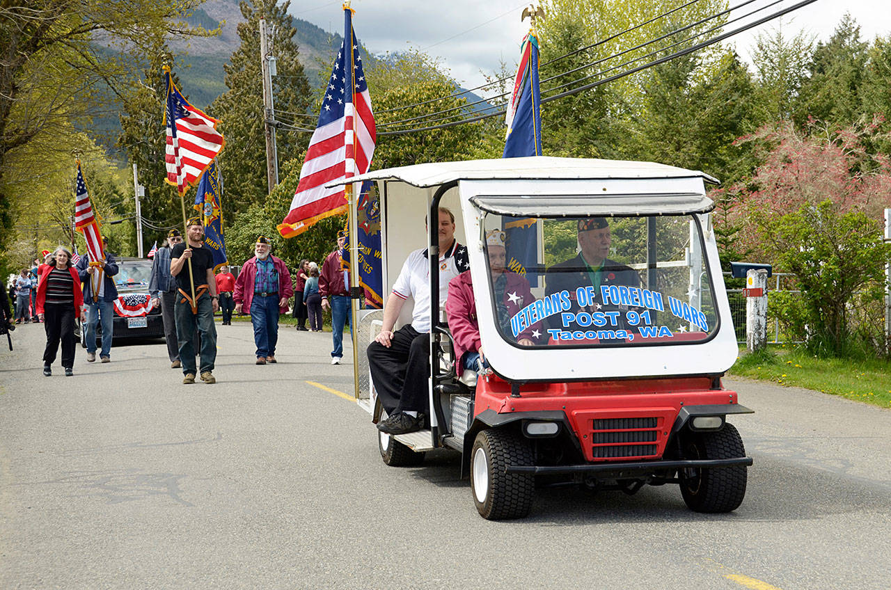 Members of the Veterans of Foreign Wars Post 91 of Tacoma march in the Brinnon Loyalty Day parade Friday. (Cydney McFarland/Peninsula Daily News)