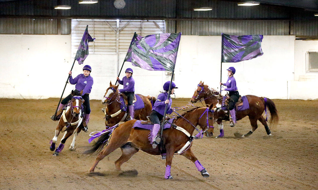 Sequim’s drill team freestyle 4s team — which includes, from front of line to back, Sydney Balkan, Amy Tucker, Miranda Williams and Emelie Furst — won a silver medal and qualified for the Washington State High School Equestrian Team’s State Finals during the third District 4 meet March 24-26 in Spanaway. (Katie Salmon Newton)