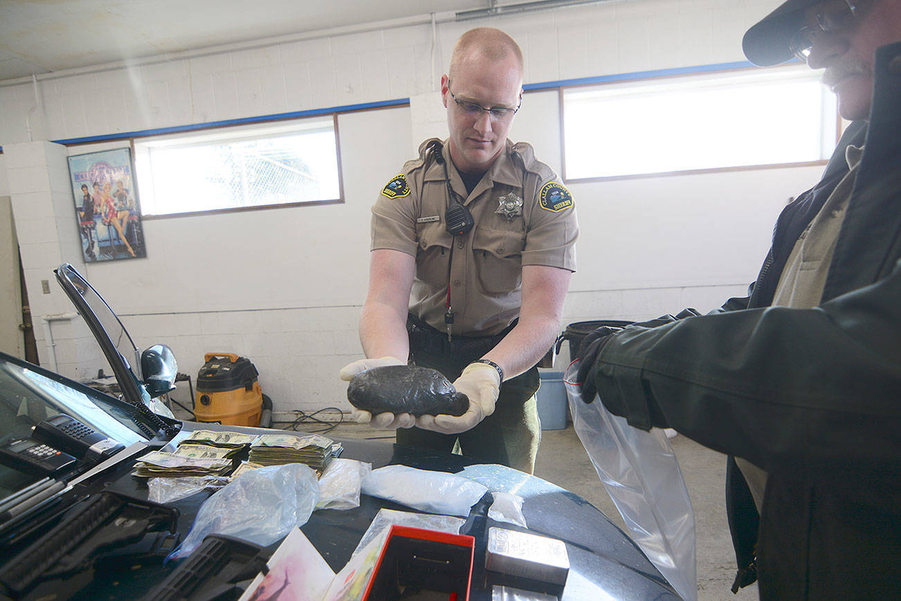Suspicious vehicle report yields heroin, meth, guns