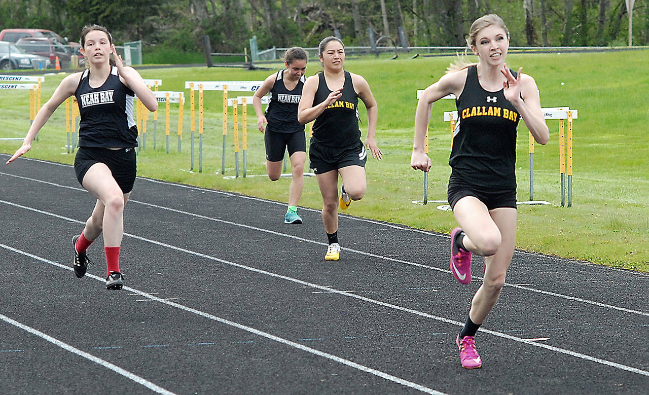 Keith Thorpe/Peninsula Daily News                                Jennica Maines of Clallam Bay, right, sprints of ahead of her competitors to win the 100 meter dash on Friday in Joyce. Following her were, from left, Ariana Corpuz and Iesha Johnson, both of Neah Bay, and Mariah LaChester of Clallam Bay.