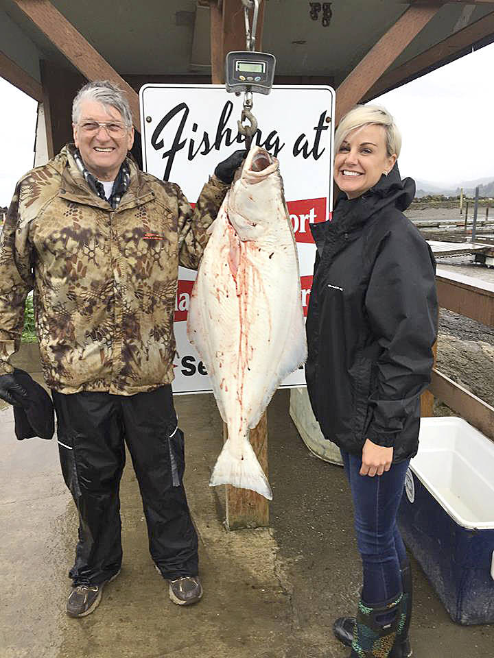 Mason’s Olson Resort                                Charles Lacey caught this 43-pound halibut off Slip Point near Sekiu. He was fishing out of Mason’s Olson Resort. Resort owner Dawn Mason is at right.