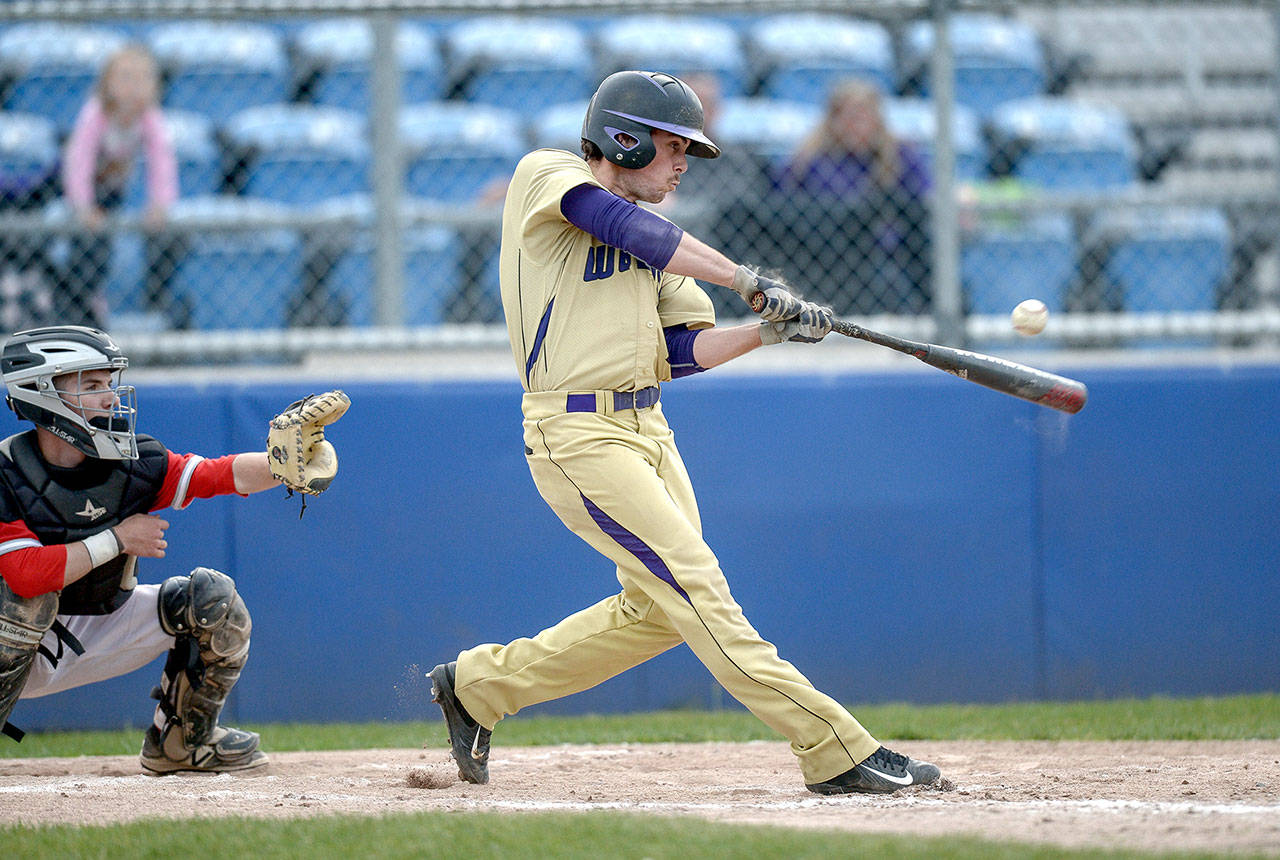 Jeff Halstead/For Peninsula Daily News                                Sequim’s James Grubb swings at a pitch during a district playoff game against Steilacoom High School at Kitsap County Fairgrounds. Sequim won 6-5.