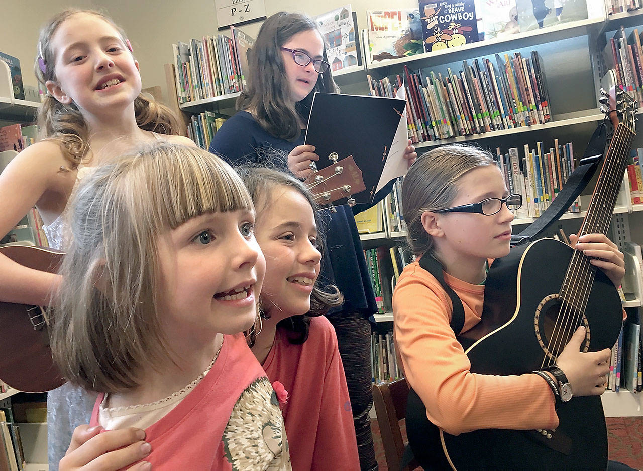 Jessalyn Northey, Lila Florence Morgan, Charlotte Capel, Emma McAdam and Mariel Price, from left, sing songs in rehearsal for the Port Townsend Children’s Library Choir’s concert Saturday.