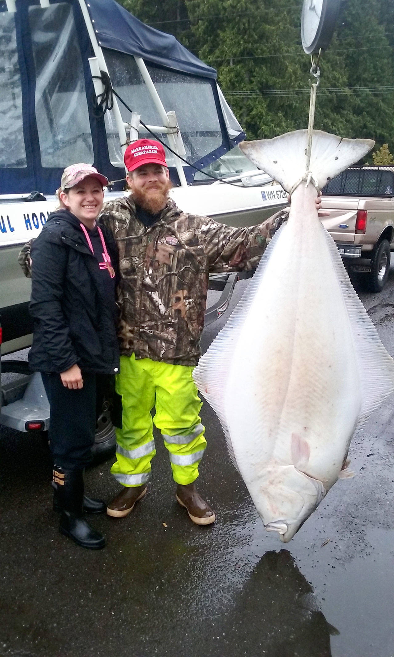 Port Angeles’ Bobby Harrison and Leanne Price caught this 155-pound halibut in 80 feet of water on the third day of halibut fishing last Thursday.