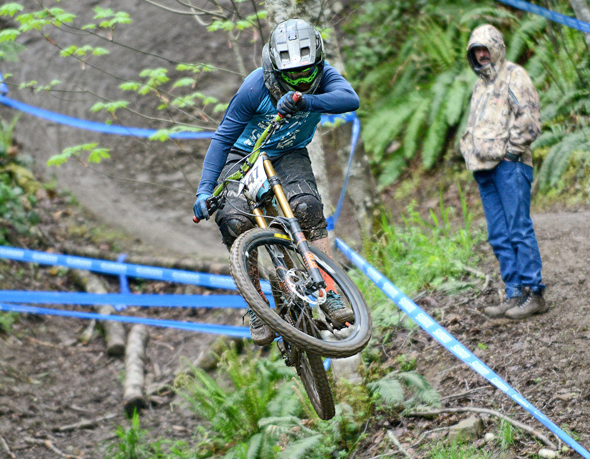 Jesse Major/Peninsula Daily News Cole Townsend of Mukilteo gets some air while riding in the Northwest Cup downhill mountain bike races at Dry Hill Sunday. Townsend came in 10th in the Cat 1 Men’s 19-29 division.