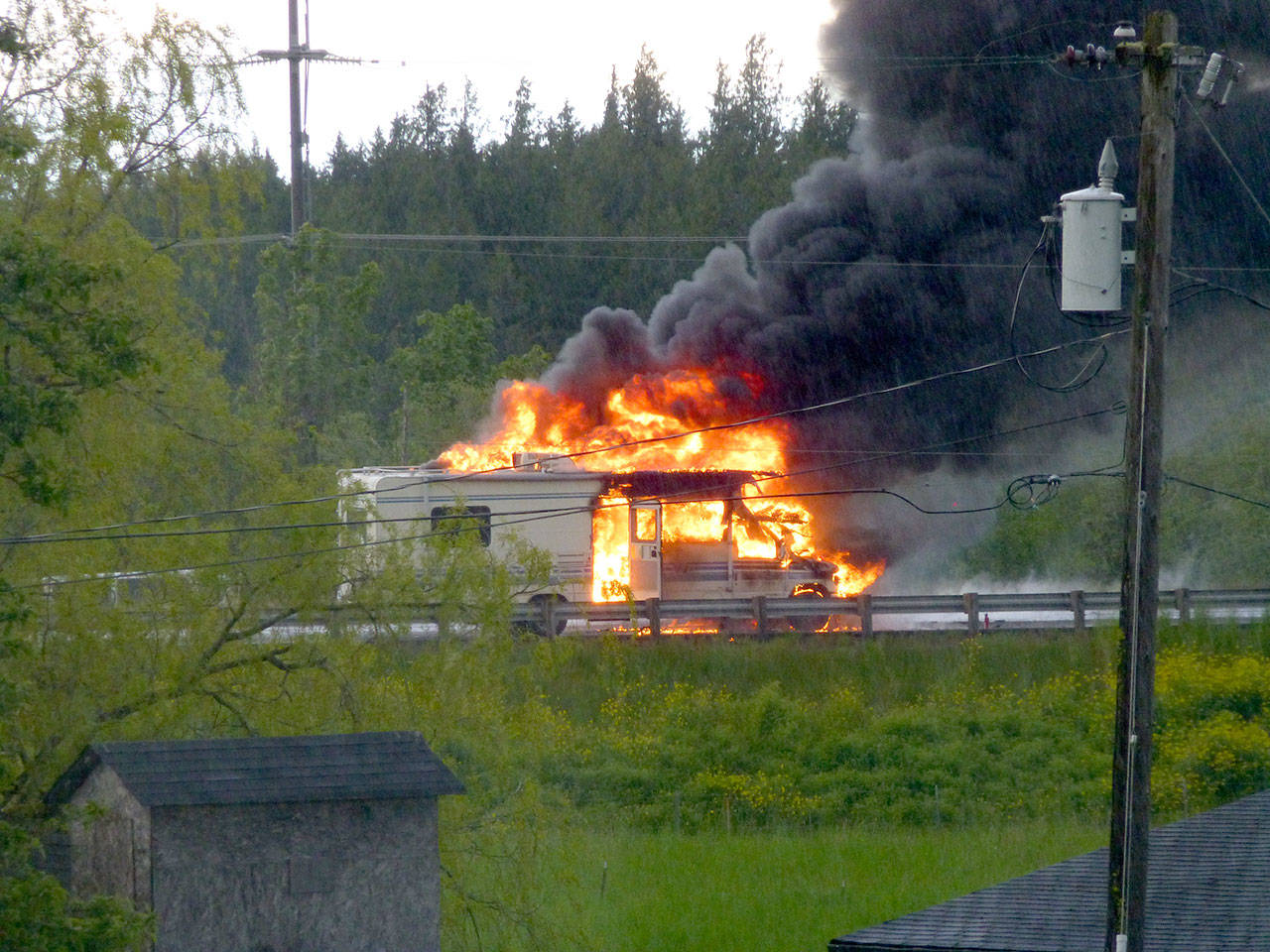 No injuries were reported in this recreational vehicle fire on U.S. Highway 101 east of Sequim on Sunday. (Pauline Geraci)