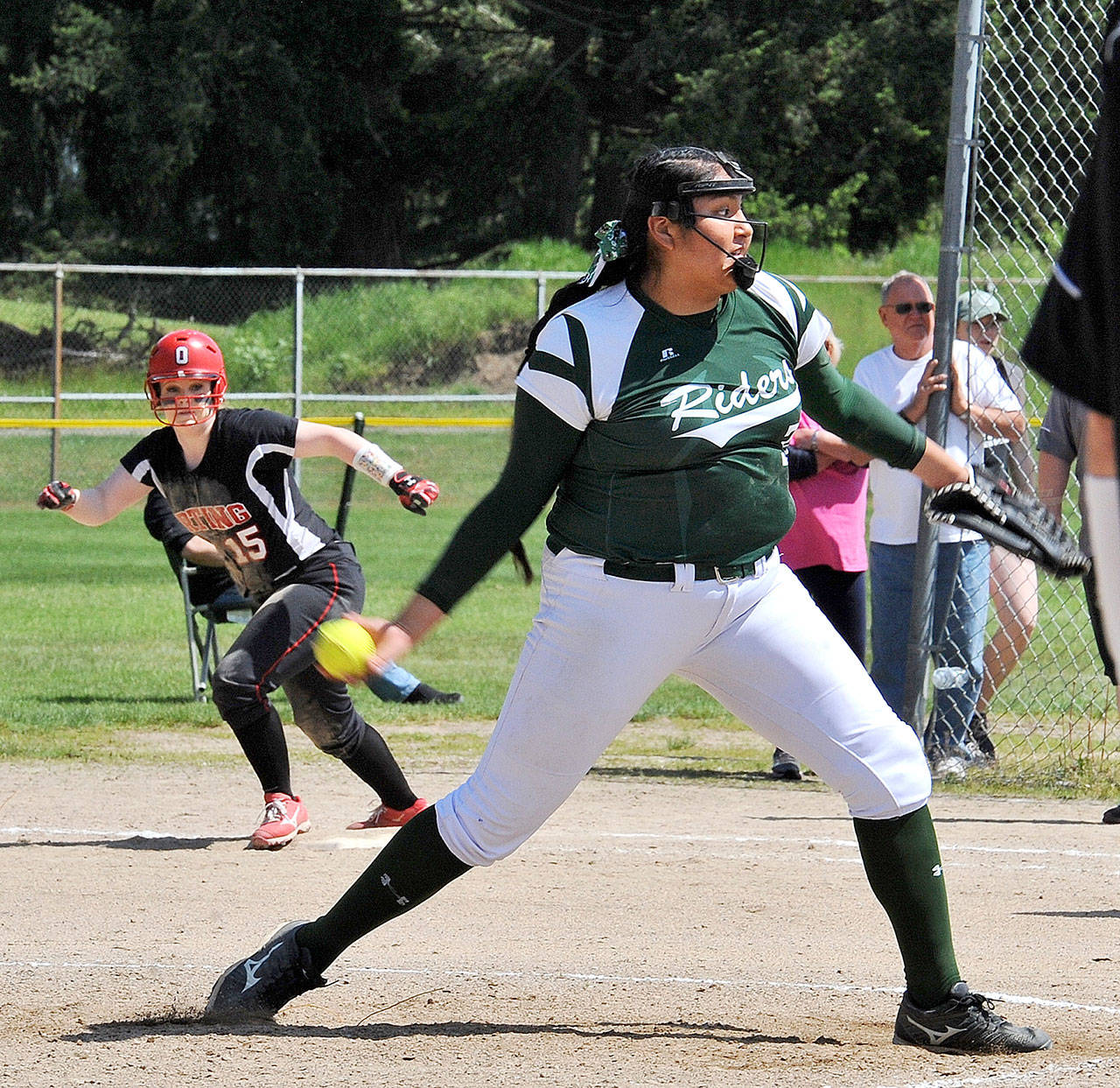 Lonnie Archibald/for Peninsula Daily News Port Angeles’ Nizhoni Wheeler delivers a pitch in the Roughriders’ West Central District 3 semifinal 16-0 win over Orting. The Riders went on to beat White River 13-2 in the district championship game later in the day.