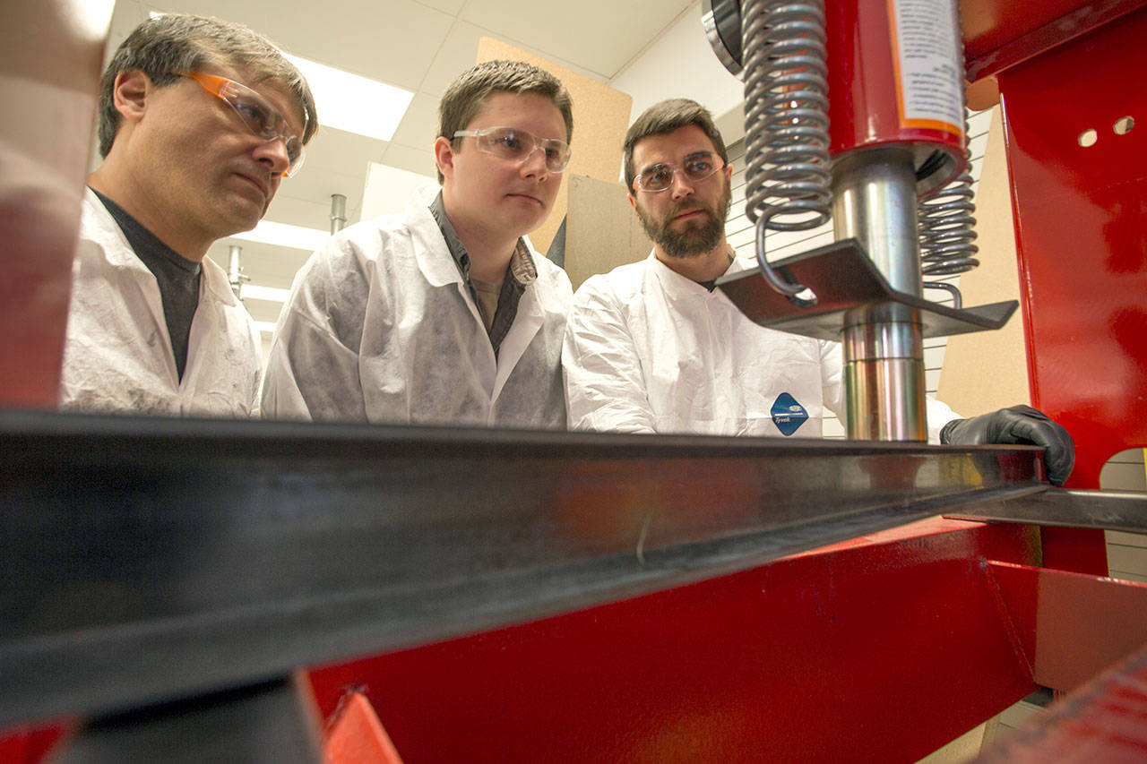 Testing the I-beam earlier this month are, from left, Keith Lesnick, Andrew Martyanov, and Scott Ohman. Not pictured is team member Dustin Henning.