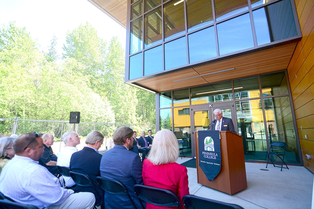 Peninsula College President Luke Robins welcomes visitors during the grand opening of the college’s Allied Health and Early Childhood Education Building on Monday. (Jesse Major/Peninsula Daily News)