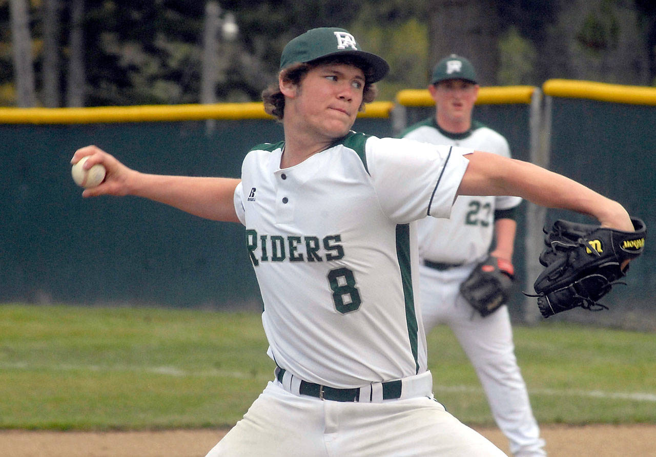 Keith Thorpe/Peninsula Daily News Port Angeles’ Dane Bradow pitches against Chimacum on April 14 at Volunteer Field. In the background is teammate Brody Merritt.