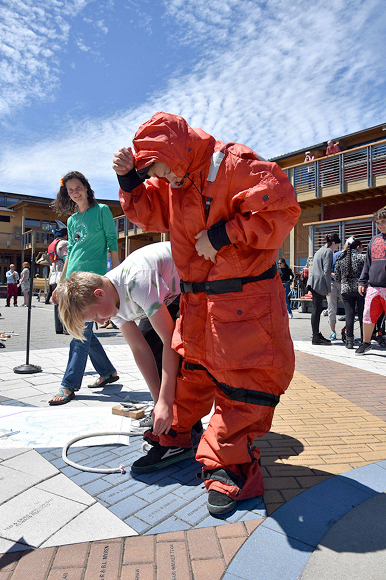 A maritime-themed relay race with exposure suits was part of the final-day celebration of the Blue Heron Maritime Discovery Program in 2016.