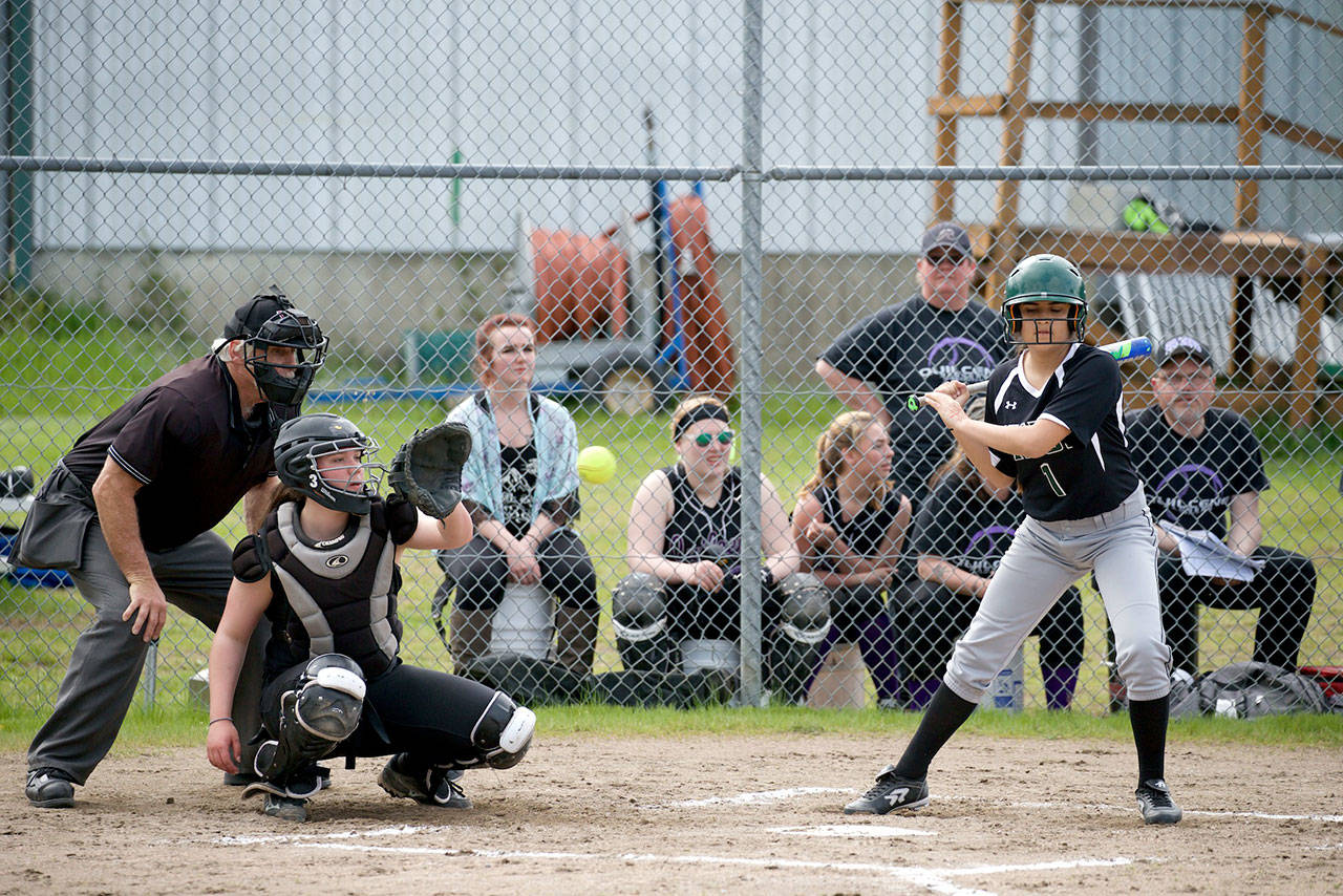 Steve Mullensky/for Peninsula Daily News                                Quilcene catcher Erin Macedo focuses on the ball as Muckleshoot’s Anez Rincon takes a pitch during a softball game earlier this season.                                Steve Mullensky/for Peninsula Daily News Quilcene catcher Erin Macedo focuses on the ball as Muckleshoot’s Anez Rincon takes a pitch during a softball game earlier this season.