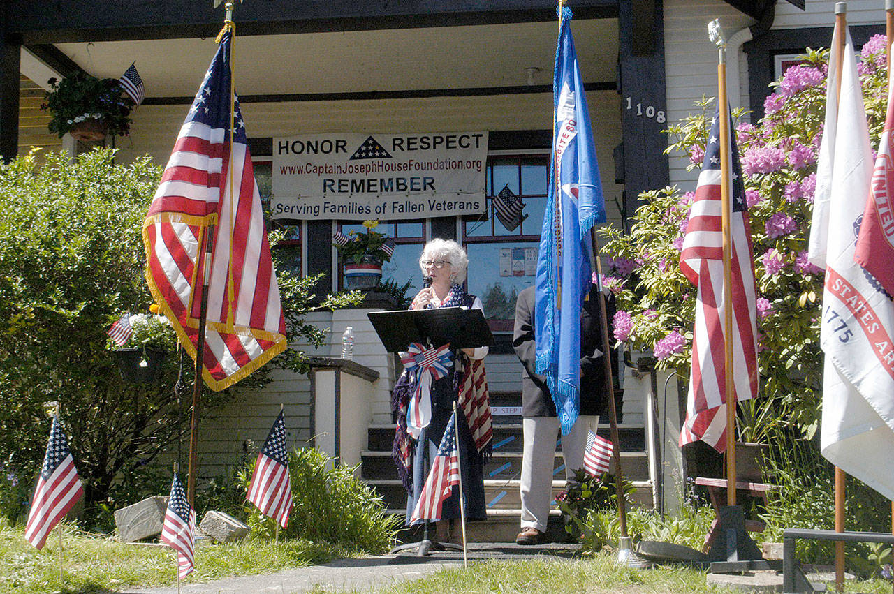 Betsy Reed Schultz of Port Angeles addresses the crowd at the Captain Joseph House Memorial Day Weekend service in Port Angeles on Sunday. The annual ceremony honors the men and women who died while serving in the U.S. armed forces. Schultz’s son, Army Capt. Joseph Schultz, was killed while serving in Afghanistan on May 29, 2011. (Rob Ollikainen/Peninsula Daily News)