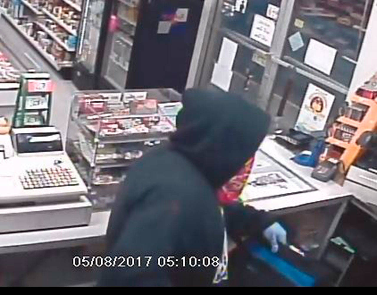 This image from surveillance footage shows a robbery suspect in a Port Angeles business on Monday.
