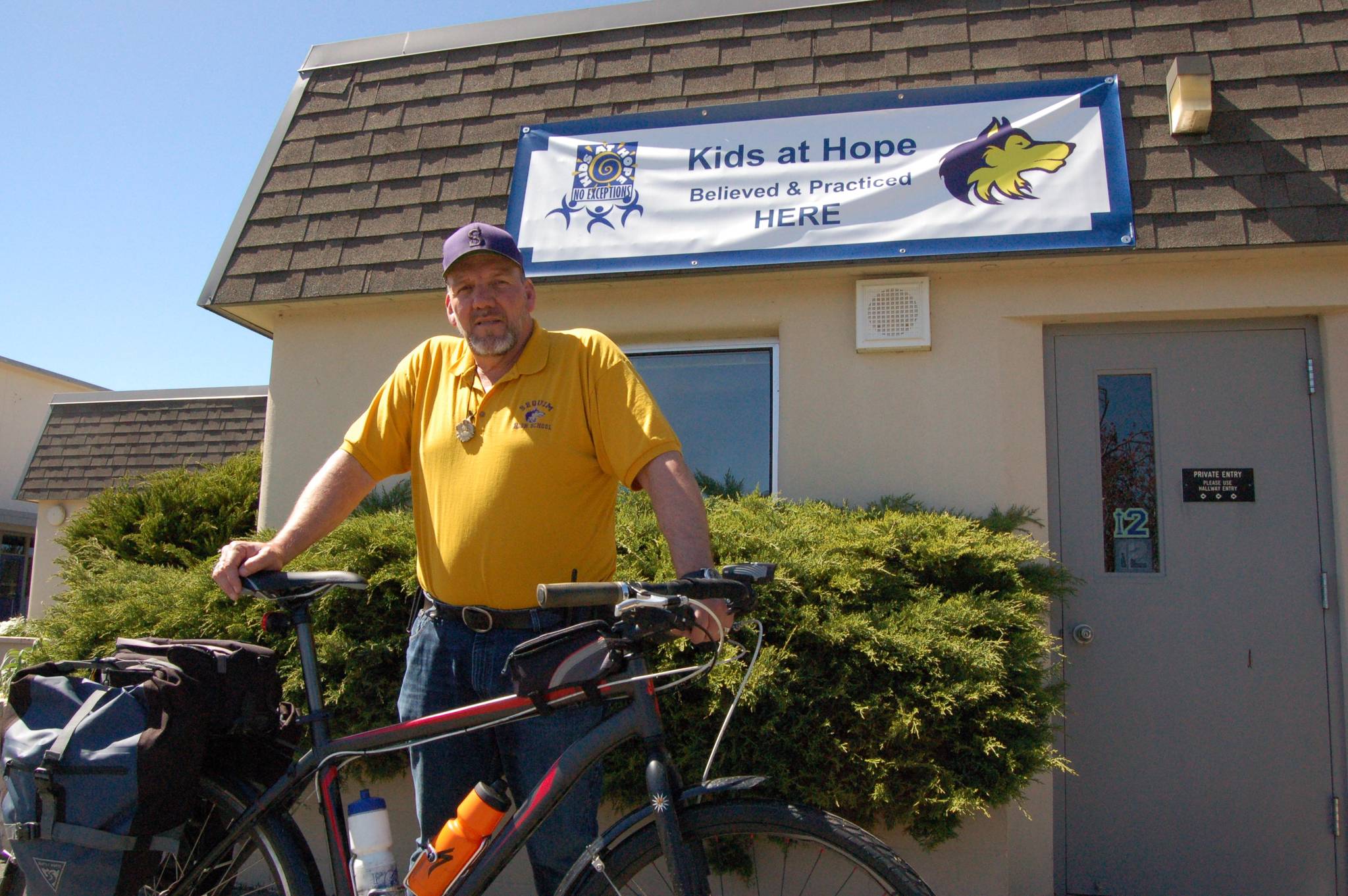 Dave Toman, a Sequim School District security guard and member of the Sequim Bicycle Alliance, rides his bike to work every day. He is part of an initiative to encourage bicyclists to ride throughout the month of May and beyond. (Erin Hawkins/Olympic Peninsula News Group)