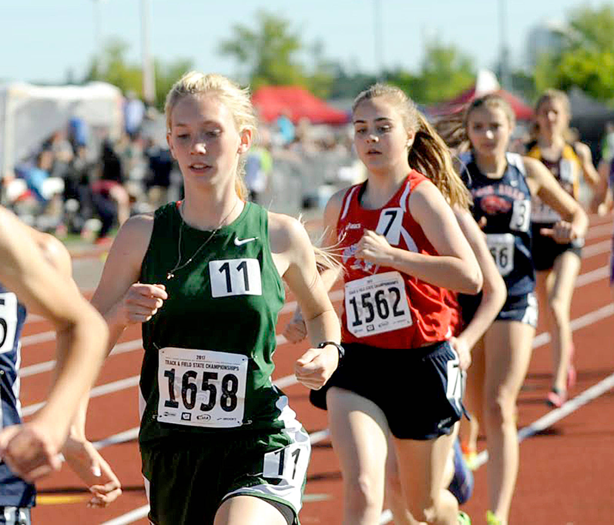 Michael Dashiell/Olympic Peninsula News Group Port Angeles’ Gracie Long (No. 1658) finished seventh in the girls’ 1,600-meter run Friday at the State 2A Track and Field Championships at Mount Tahoma High School. Long’s time of 5:08.58 broke a 33-year-old Port Angles High School record.