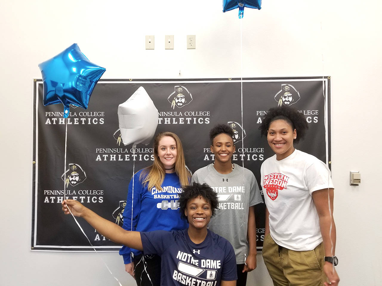 Peninsula College Athletics                                Peninsula College women’s basketball players, from left, Alicia Dugan, Jenise McKnight, Anaya Rodisha and Tai Thomas all signed letters of intent Wednesday to continue their careers at four-year universities.