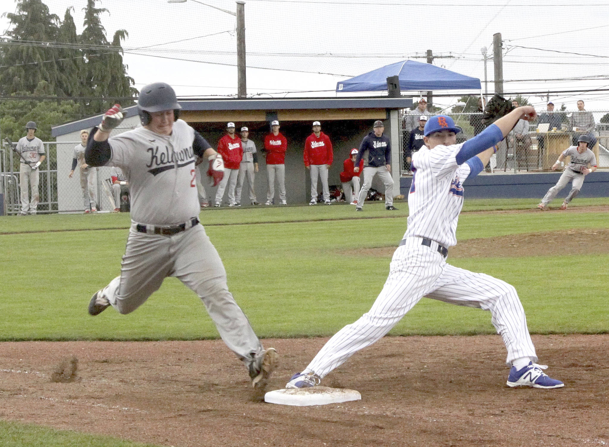Dave Logan/for Peninsula Daily News                                Port Angeles Lefties pitcher Drew Zmuda, right, covers first base as Kelowna&rsquo;s Bo Meikljohn reaches for the base. Meikljohn was called out but the Falcons picked up a three-game sweep of the Lefties.