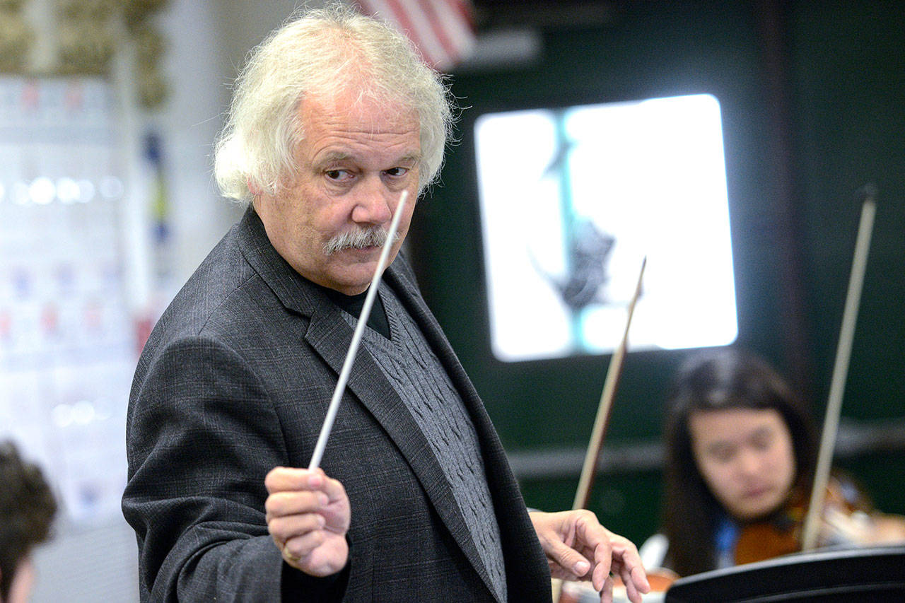 Longtime Port Angeles orchestra teacher Ron Jones conducts the Port Angeles High School chamber orchestra last month. (Jesse Major/Peninsula Daily News)