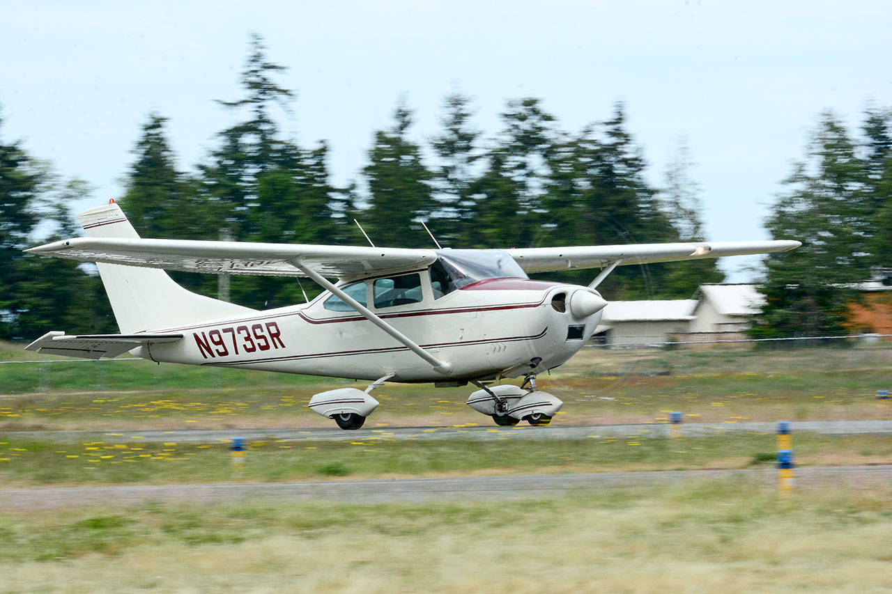 A 1968 Cessna 182L lands at Fairchild International Airport in Port Angeles on Wednesday. The Port of Port Angeles is working to secure commercial air service. (Jesse Major/Peninsula Daily News)