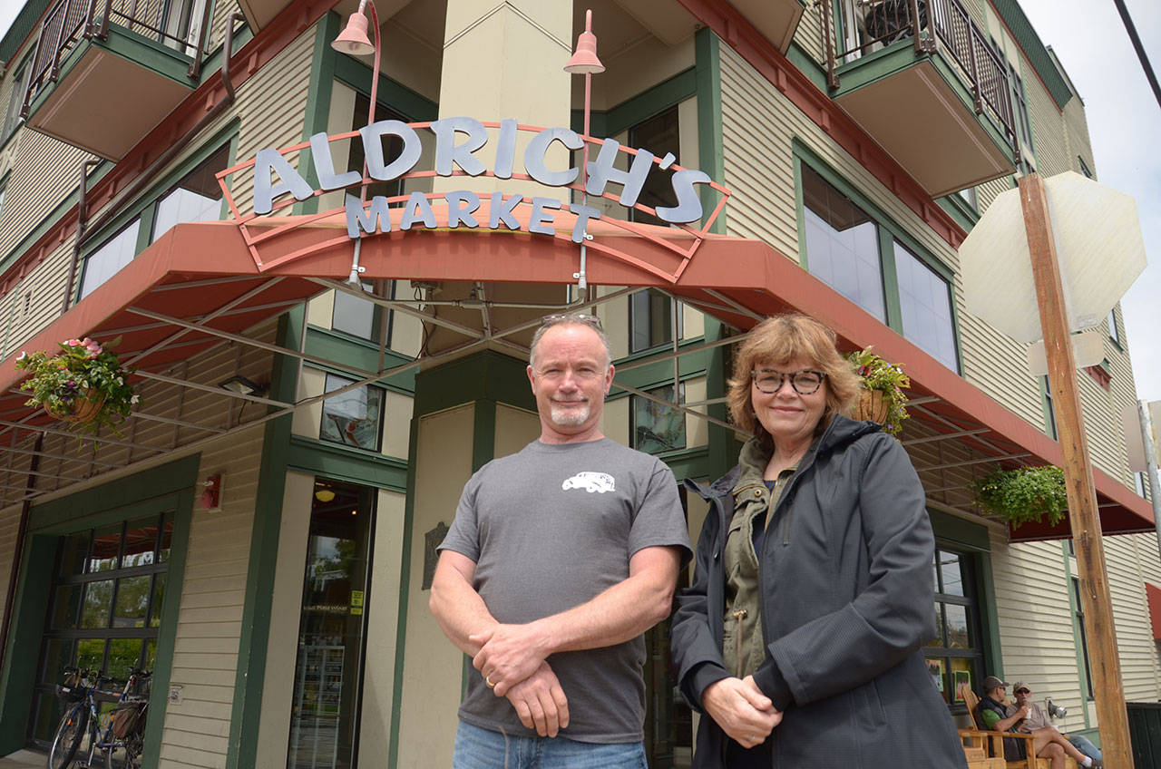 From left, Aldrich’s Market co-owner Scott Rogers is one of many local vendors participating in this year’s Taste of Port Townsend, which is coordinated by Mari Mullen, executive director of the Port Townsend Main Street Program. (Cydney McFarland/Peninsula Daily News)