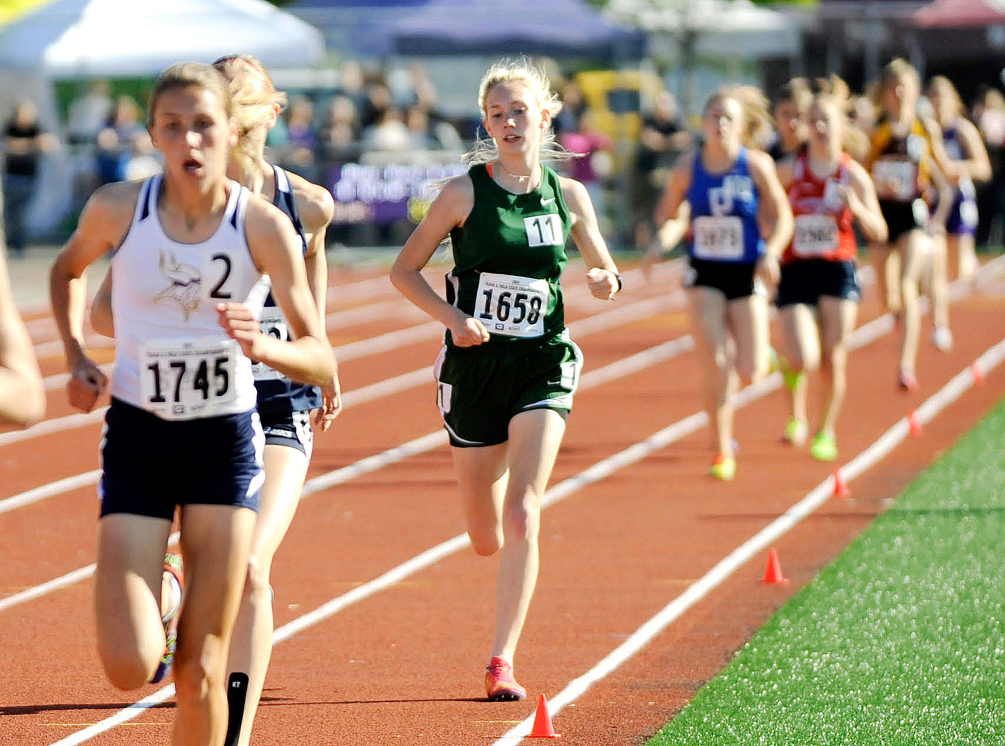 Port Angeles’ Gracie Long (in green) running at the state 2A Track and Field Championships at Mount Tahoma High School last month. Long finished fifth in the 3,200 meters and seventh in the 1,600 meters, breaking 30-year-old Port Angeles school records in both events.                                Michael Dashiell/Olympic Peninsula News Group                                Michael Dashiell/Olympic Peninsula News Group Port Angeles’ Gracie Long (in green) running at the state 2A Track and Field Championships at Mount Tahoma High School last month. Long finished fifth in the 3,200 meters and seventh in the 1,600 meters, breaking 33-year-old Port Angeles school records in both events.