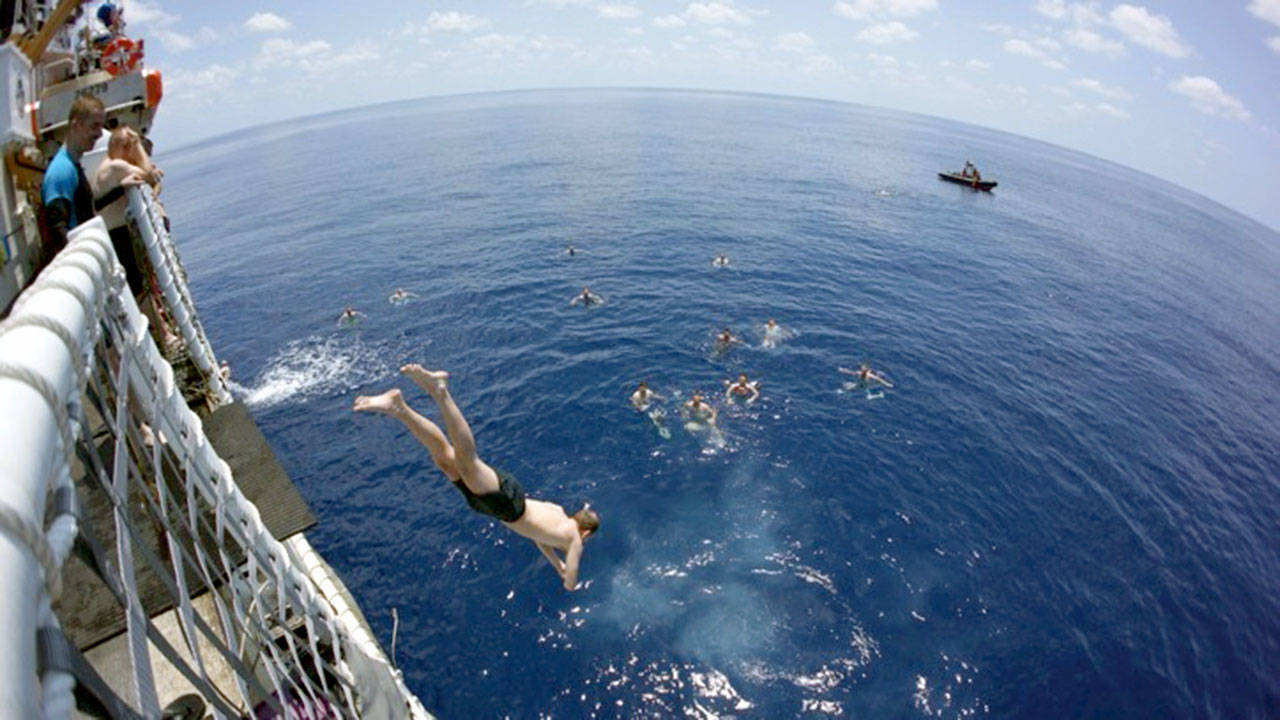 Crew members of the Coast Guard cutter Active dive off and swim in the Eastern Pacific Ocean off the coast of Costa Rica in May. (Lt. Cmdr. Jennifer Runion/U.S. Coast Guard)