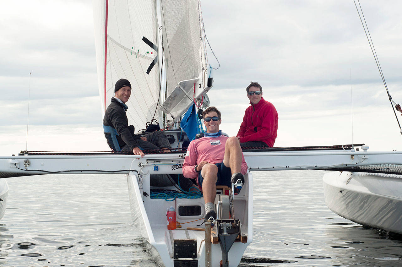 Brothers Tripp, Chris and Trevor Burd of Team Pure & Wild/Freeburd were the first to cross the finish line in Ketchikan after 750 miles of sailing and peddling. (Daphne Stuart/R2AK)