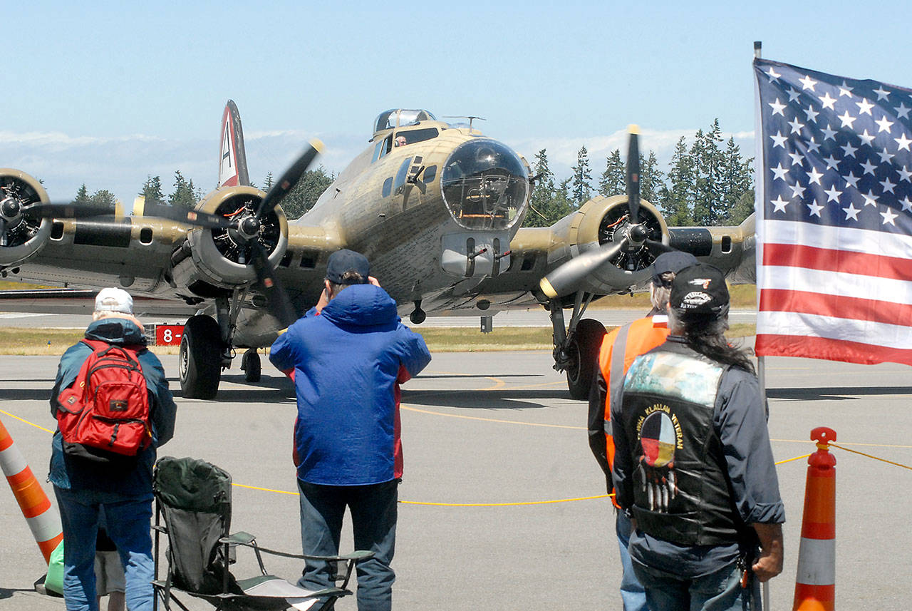 The Wings of Freedom&rsquo;s B-17 bomber taxis into the tarmac Wednesday after taking a group of World War II veterans on a complimentary ride. (Keith Thorpe/Peninsula Daily News)