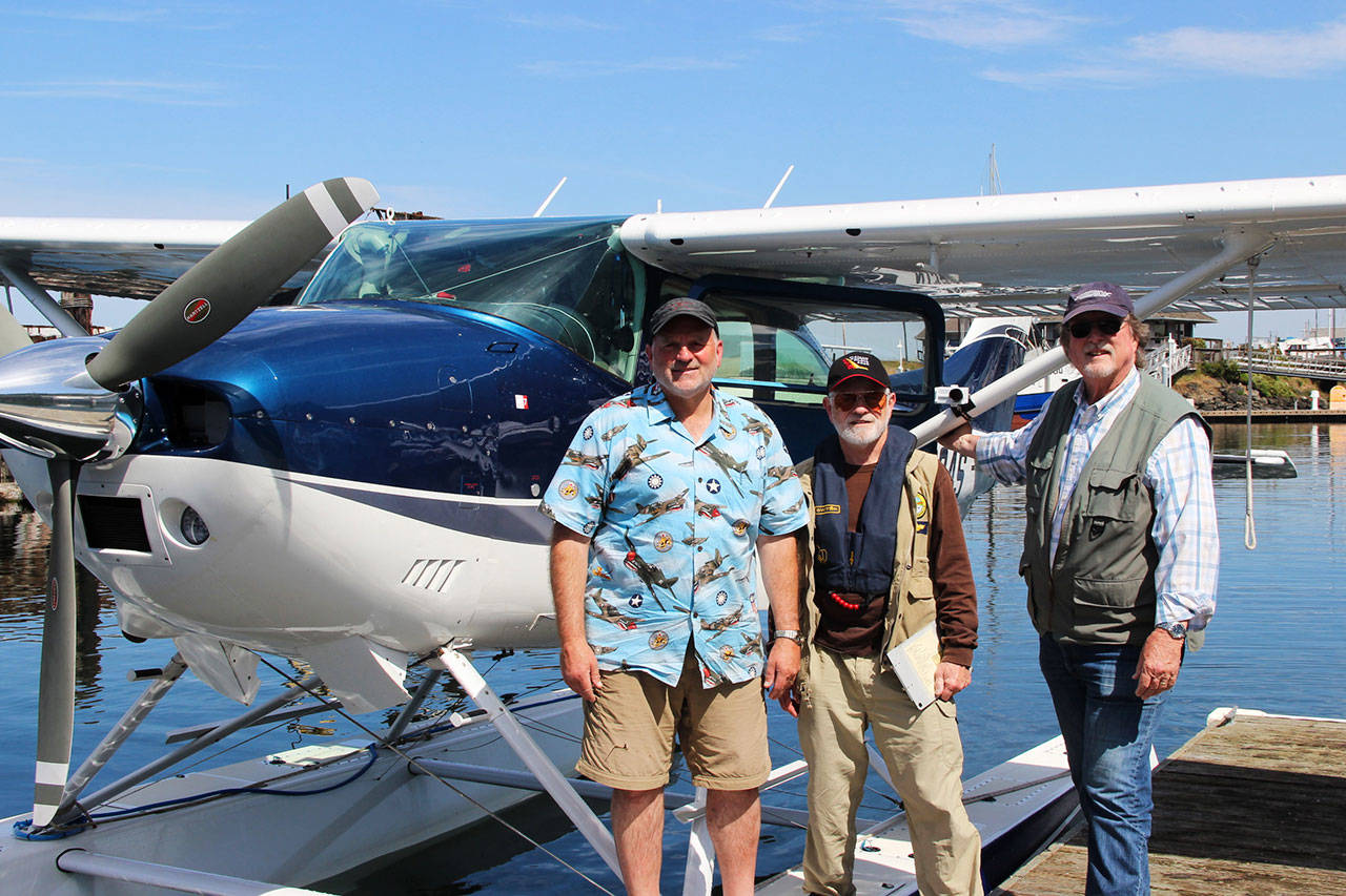 From left, Don Goodman, Dave Miller and Alan Barnard stand with a sea plane after Goodman flew Miller to map landing opportunities in Clallam County. Miller and Barnard are developing a Disaster Airlift Response Team to help county residents after a catastrophic earthquake.