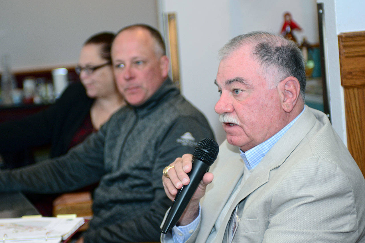 Jim Moran, right, candidate for Port Angeles City Council Position 1, answers a question during the Port Angeles Business Association candidate forum Tuesday. Marolee Smith, left, and Todd Negus also participated in the forum. (Jesse Major/Peninsula Daily News) ​