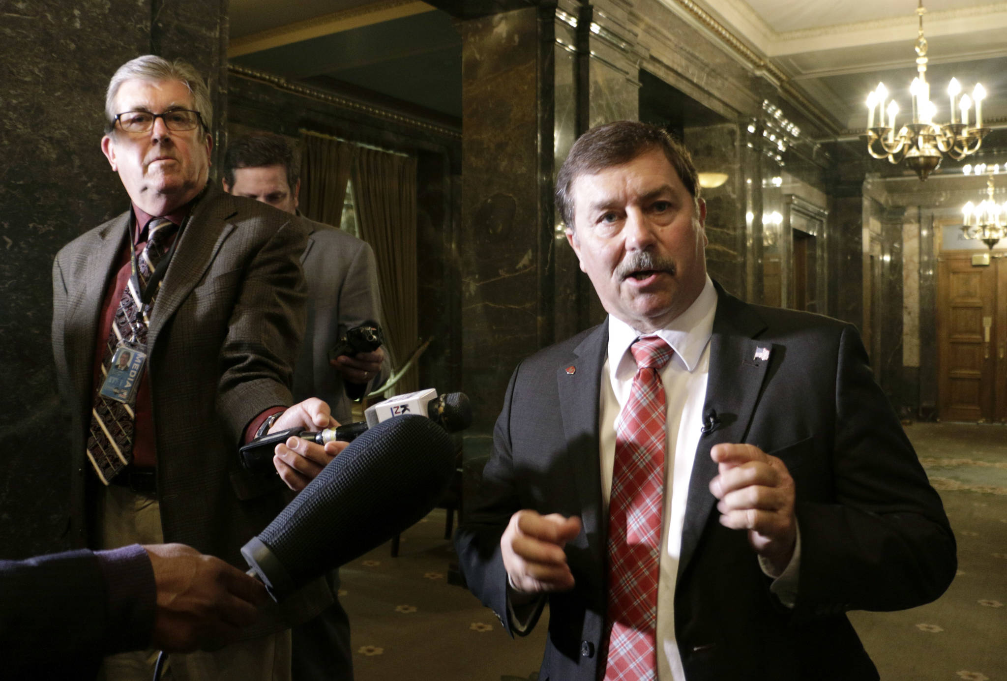 Republican Senate Majority Leader Mark Schoesler talks to the media in the Senate wings after a state budget deal was announced Wednesday in Olympia. (Rachel La Corte/The Associated Press)