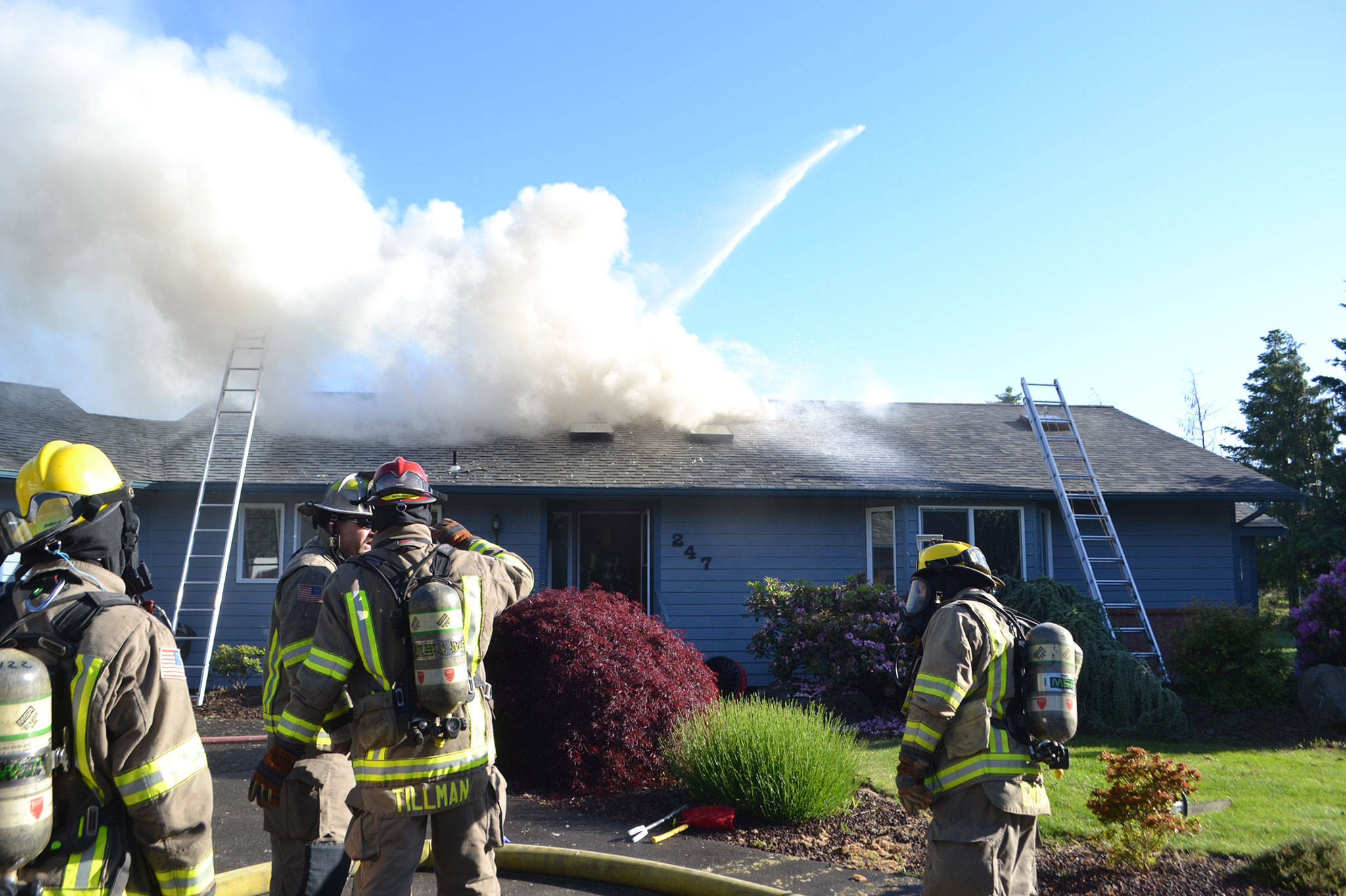 Matthew Nash (2)/Olympic Peninsula News Group                                A fire spread through the attic of a home on the 200 block of Griffith Farm Road on Sunday. Clallam County Fire District No. 3, with support from Clallam County Fire District No. 2 extinguished the fire in about two hours.