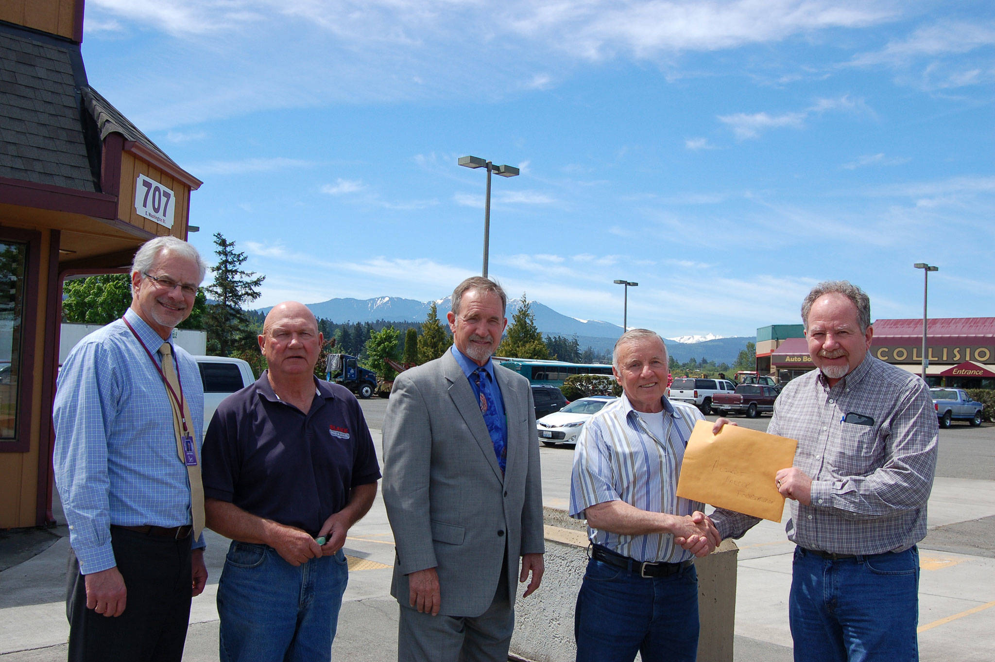 Sequim School District Superintendent and Albert Haller Foundation board member Gary Neal, left, stands with foundation secretary/treasurer Dave Blake, foundation board member and Port Angeles School District Superintendent Marc Jackson, foundation president Gary Smith and Lakeside Industries Olympic Peninsula manager Jim Wiedman, from left. Lakeside Industries of Port Angeles is donating $30,000 to the Albert Haller Foundation, a nonprofit dedicated to supporting charitable and community causes in Clallam County. (Erin Hawkins/Olympic Peninsula News Group)