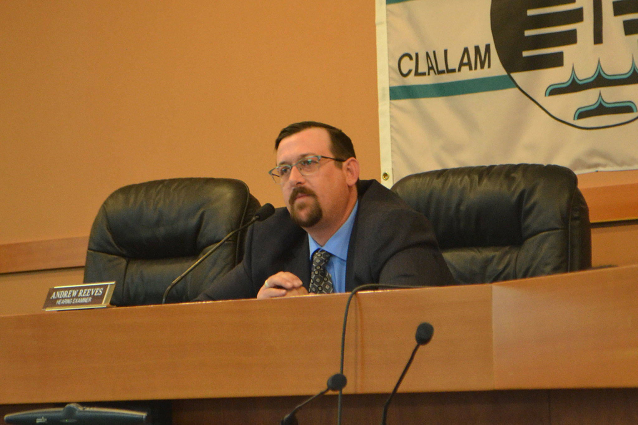 Clallam County Hearing Examiner Andrew Reeves listens to testimony June 1 in the Clallam County Courthouse about a proposed modular home community in Carlsborg.