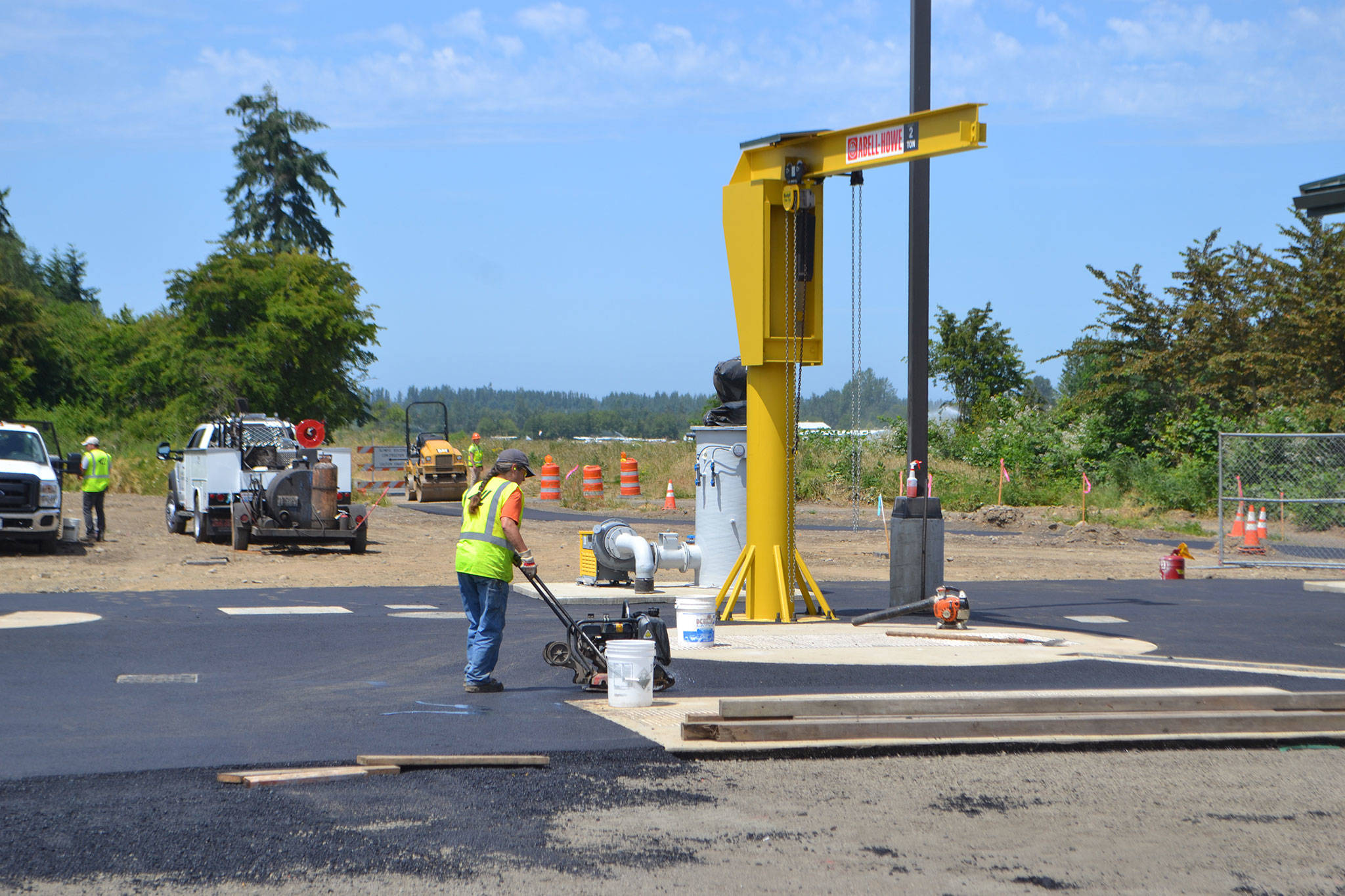Paving the pump station by the Olympic Discovery Trail is one of the final portions for the Carlsborg Sewer Project. Physical work began in April 2016, and it will cost more than $9 million to finish. (Matthew Nash/Olympic Peninsula News Group)