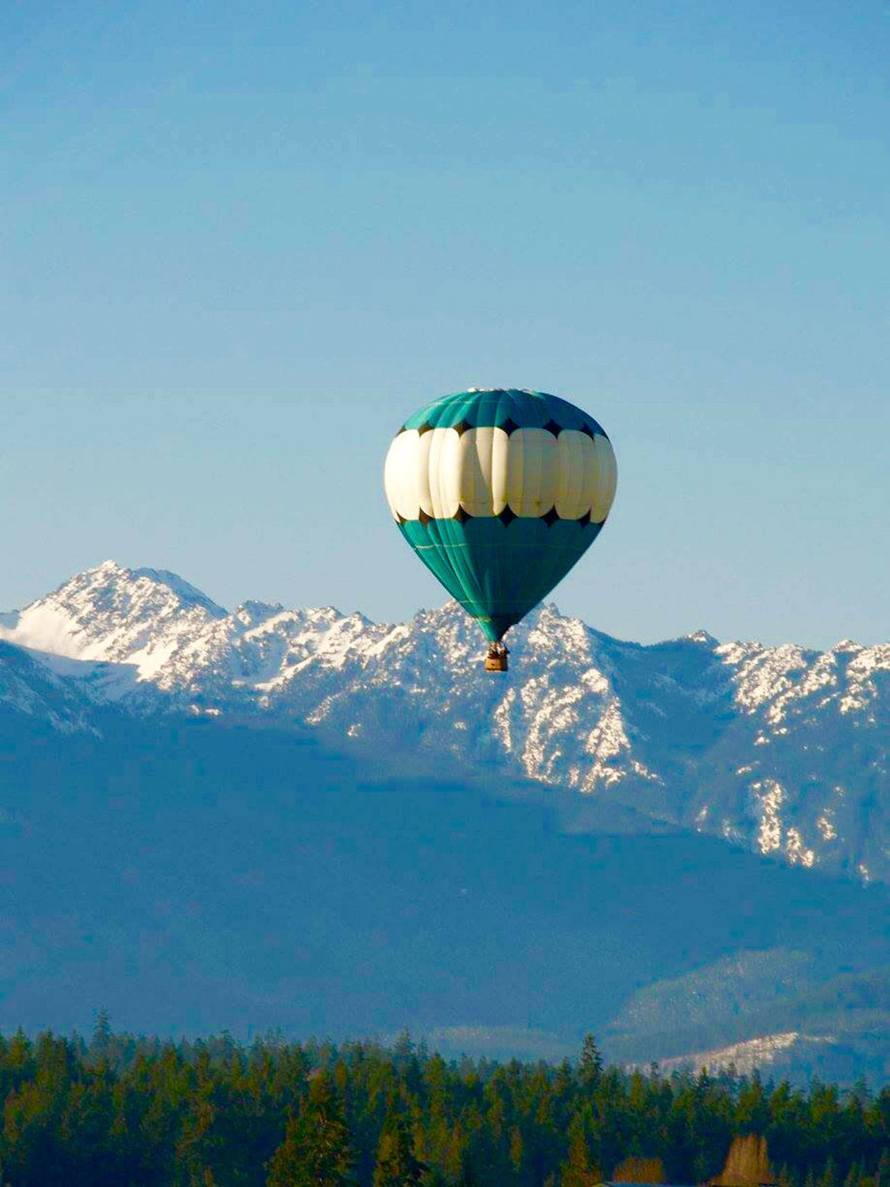 Up to seven hot air balloons, including Captain Crystal Stout’s balloon, pictured, could be flying over Sequim for Aug. 26-27, but organizers of the Olympic Peninsula Air Affaire need at least three-four passengers each day to make it viable. (Morning Star Balloon Co.)