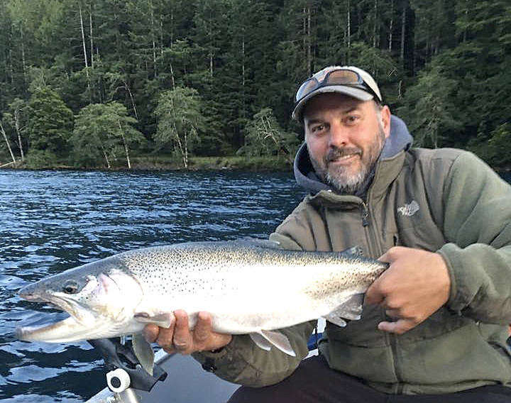 Jerry’s Bait and Tackle                                 Jerry Wright of Jerry’s Bait and Tackle in Port Angeles holds this Beardslee trout caught by Will Hart while the pair fished Lake Crescent. Wright estimated its size at more than 13 pounds.