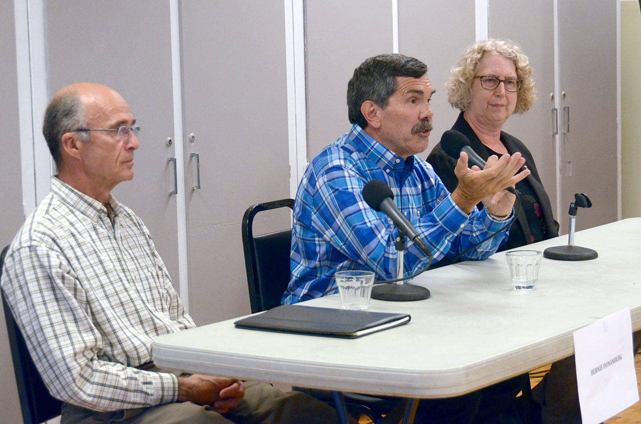 Bernie Donanberg, Bruce McComas and Cheri Van Hoover, from left, the three candidates for East Jefferson County Hospital District 2, Commissioner Position 1, answer questions at a forum in Chimacum on Wednesday. (Cydney McFarland/Peninsula Daily News)