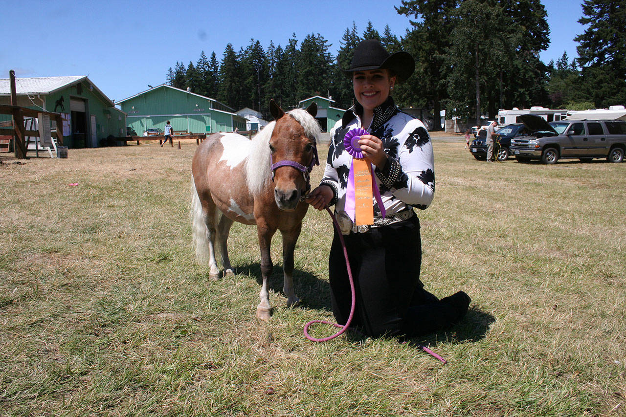 The Pony Express 4-H club’s Natalie Blankenship and her miniature horse won the Grand Championship in Halter class at last weekend’s Clallam County Neon Rider’s 4-H horse show. (Karen Griffiths/for Peninsula Daily News)